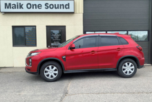 Red 2023 Mitsubishi RVR with dark privacy window tint